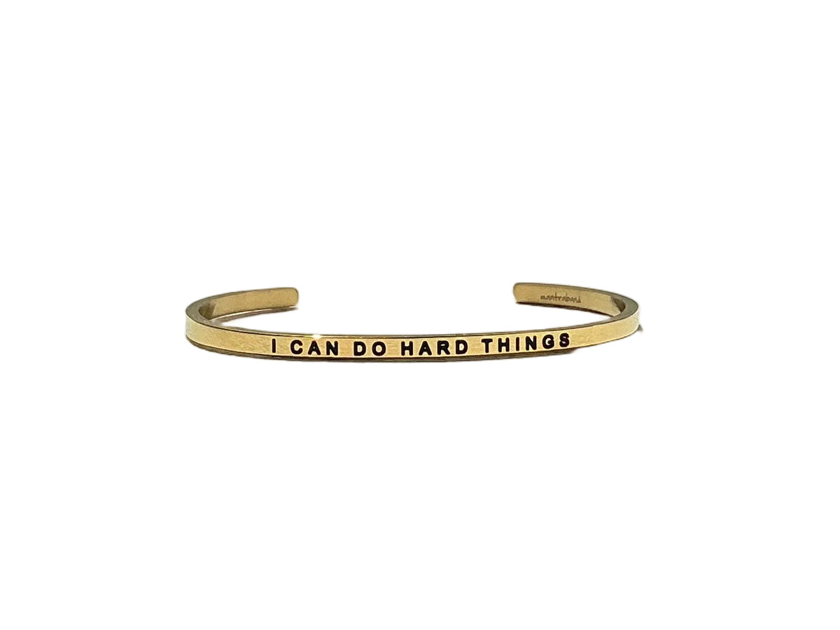 Gold cuff bracelet engraved with I CAN DO HARD THINGS by MantraBand