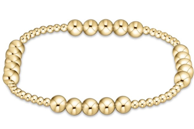 enewton Classic Gold Blissful Bracelet with graduated gold beads on white background