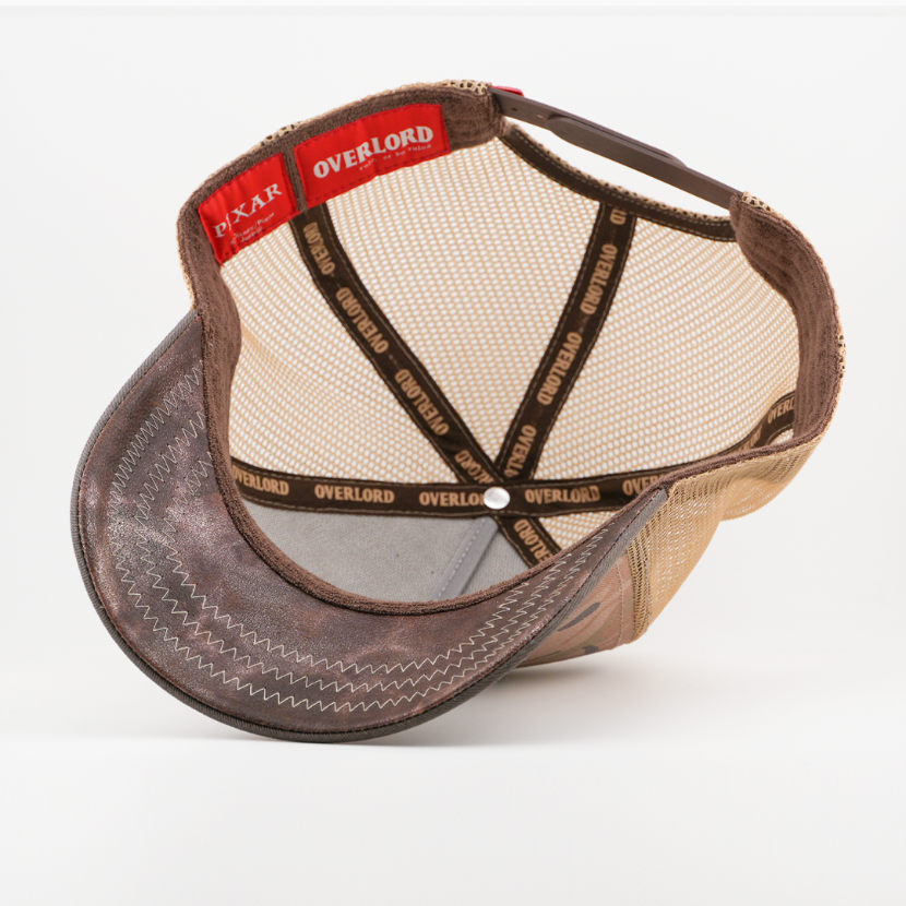 Interior underside view of Overlord x Pixar Cars Tow Mater trucker hat showing mesh crown and brim lining