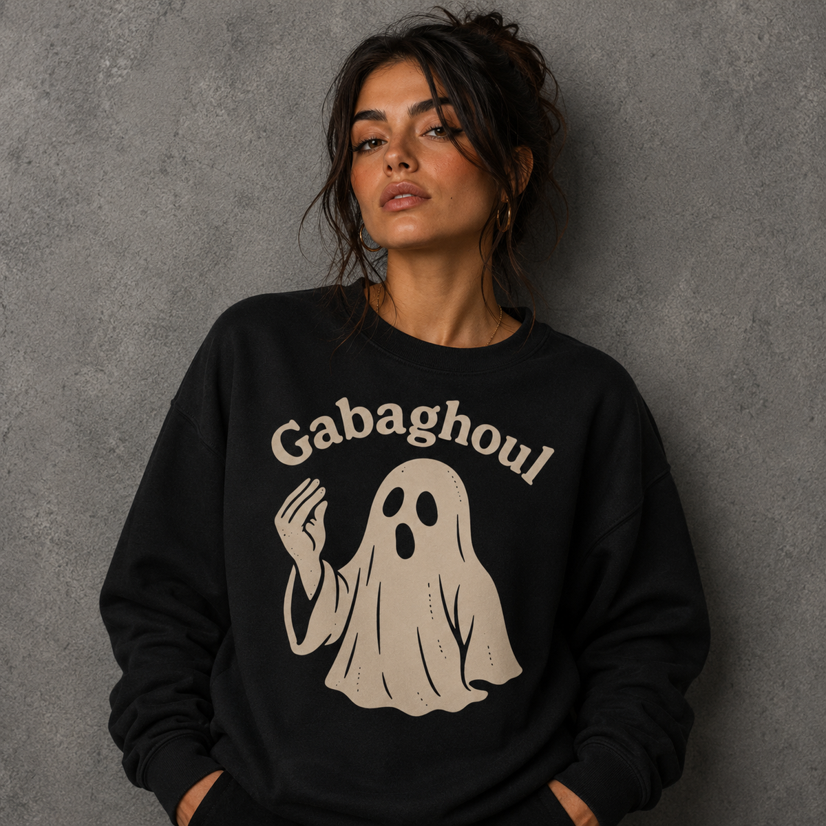 Black crewneck sweatshirt with beige Gabaghoul ghost graphic on chest