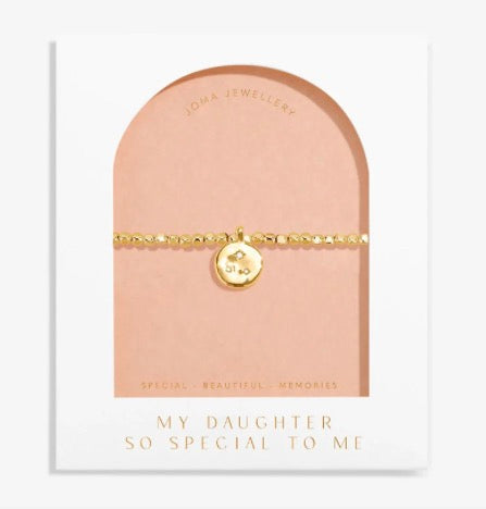 Gold beaded bracelet with round charm on blush greeting card for daughter