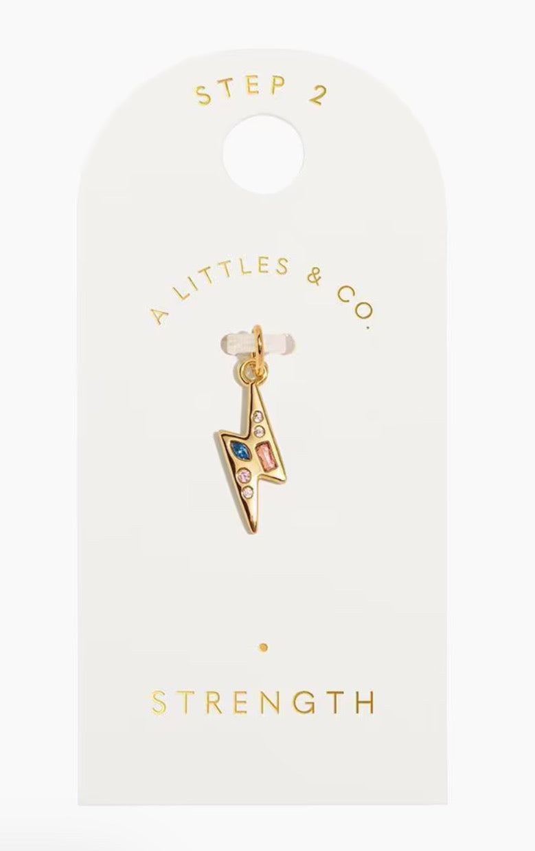 A Littles & Co. Gold Charm - Small Strength Lightning Bolt