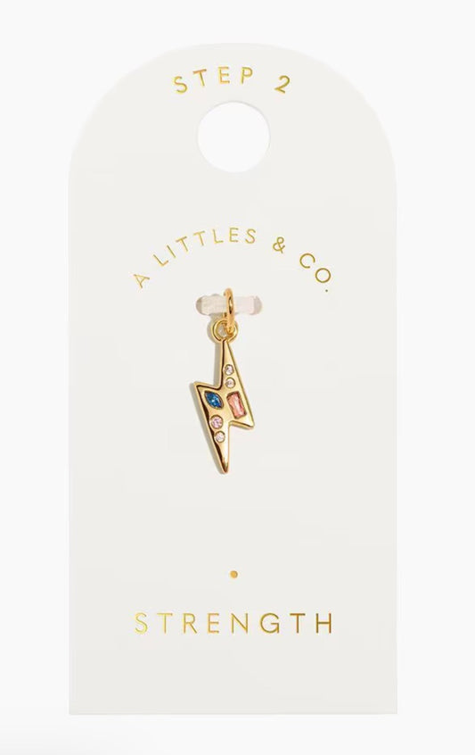 A Littles & Co. Gold Charm - Small Strength Lightning Bolt