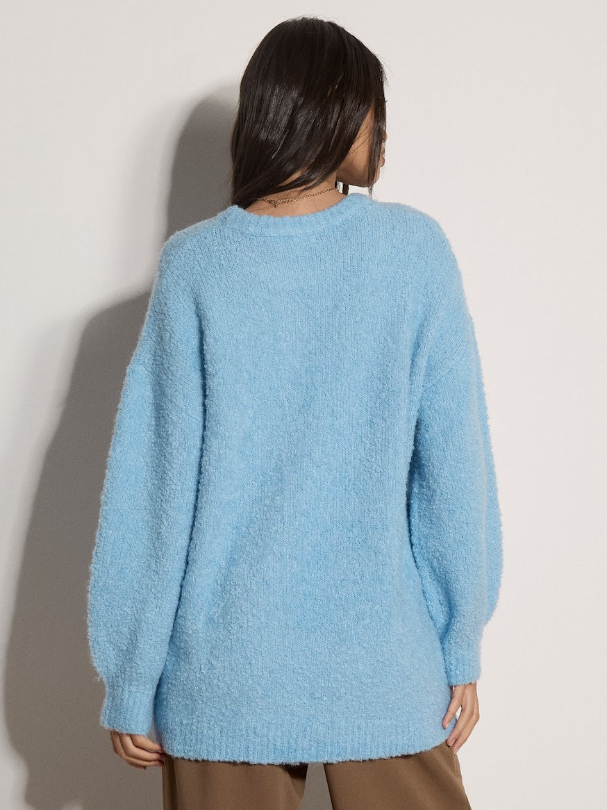Apricot light blue boucle oversized jumper, back view, crew neck, long sleeves