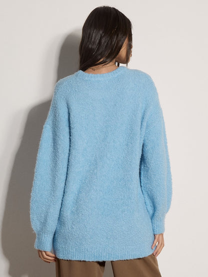 Apricot light blue boucle oversized jumper, back view, crew neck, long sleeves