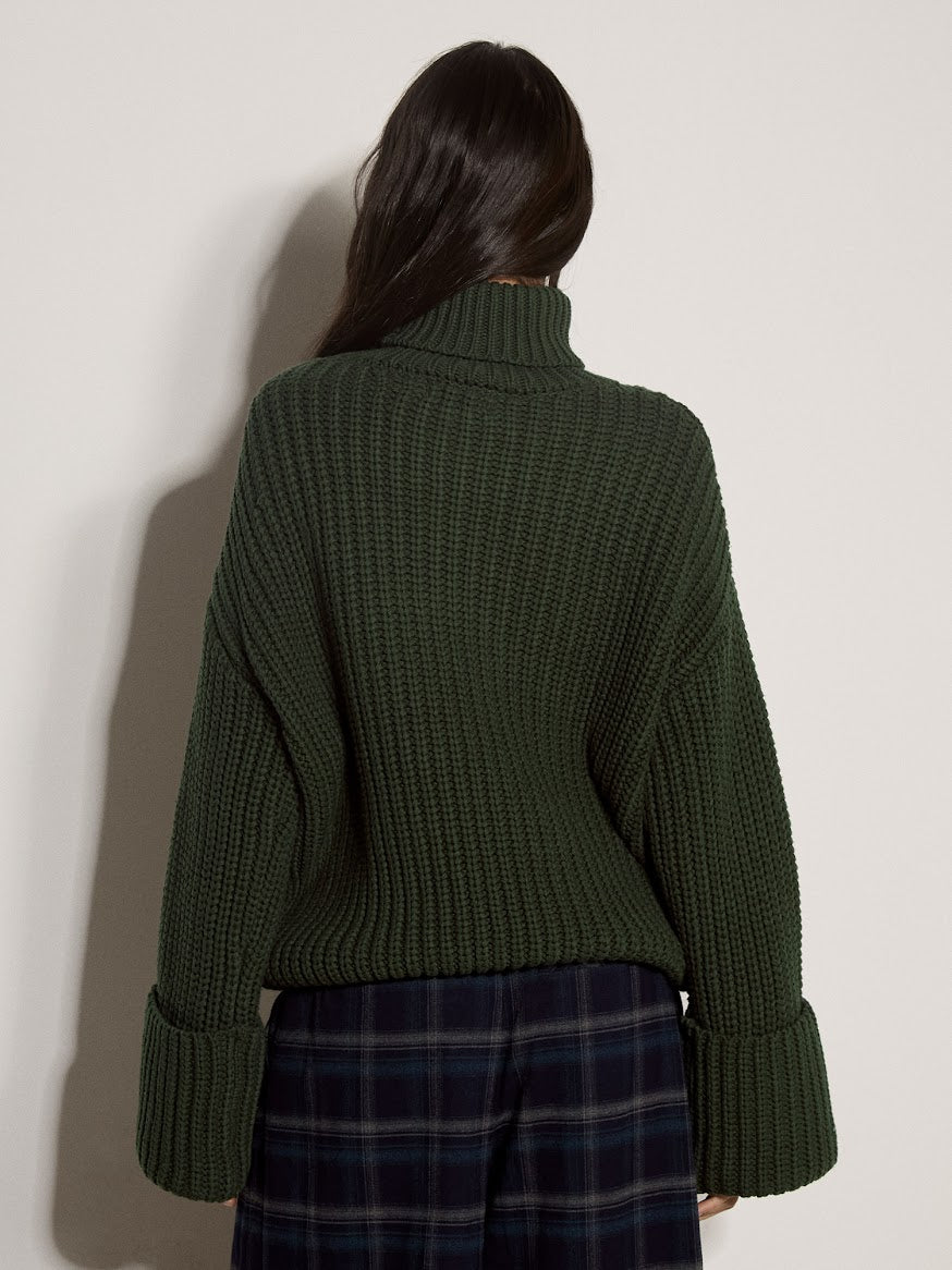Dark green chunky ribbed knit turtleneck jumper with wide cuffed sleeves