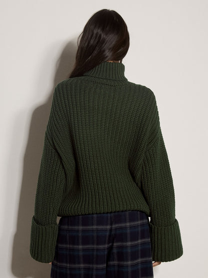 Dark green chunky ribbed knit turtleneck jumper with wide cuffed sleeves