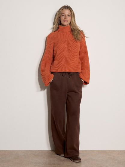 Apricot chunky cable knit turtleneck jumper in burnt orange with wide ribbed cuffs