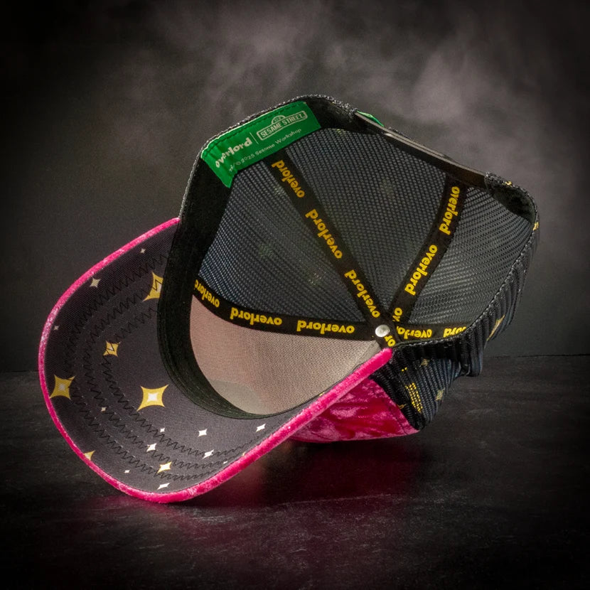 Black and pink Overlord x Sesame Street snapback trucker hat, interior view with star-print brim