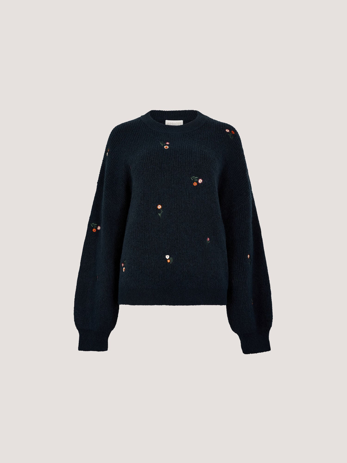 Relaxed navy knit jumper with scattered small embroidered floral motifs and balloon sleeves