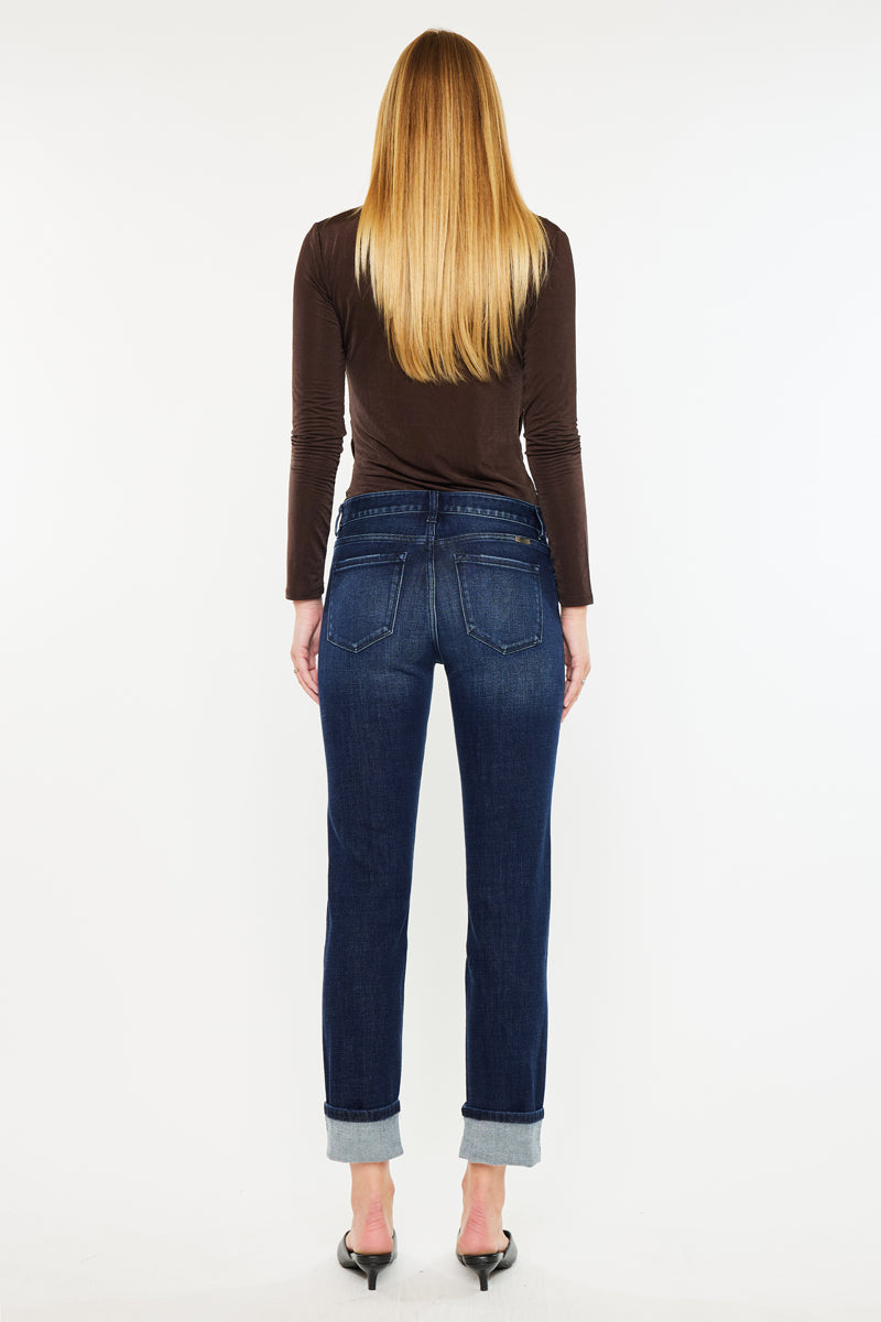 Back view of mid rise skinny straight jeans with cuffed hem on female model