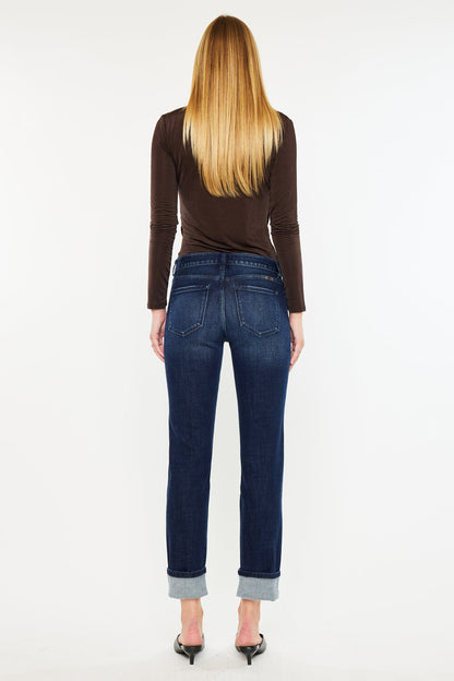 Back view of mid rise skinny straight jeans with cuffed hem on female model