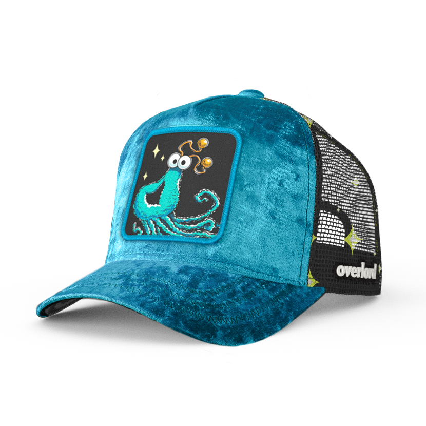 Teal velvet trucker cap with embroidered Yip-Yip alien patch on black background