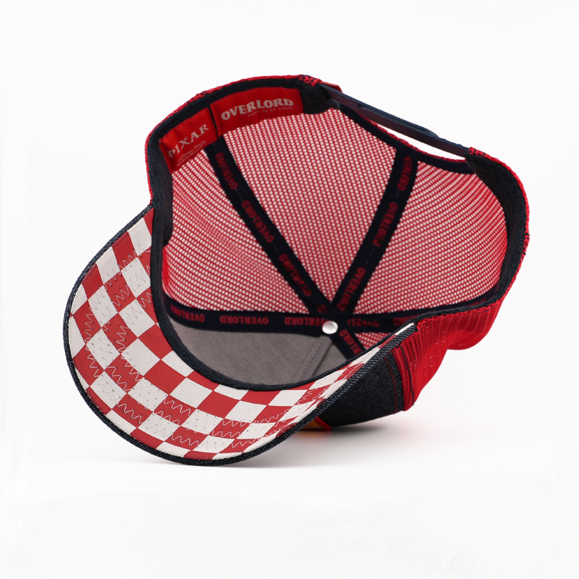 Interior underside view of snapback cap showing red checkered brim and mesh lining