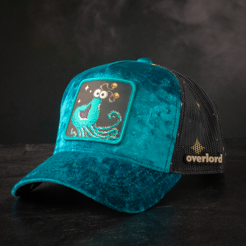 Teal velvet trucker cap with Yip-Yip alien embroidered patch and black mesh back