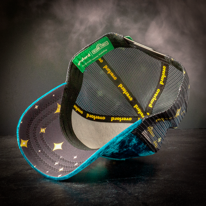 Interior underside view of a snapback hat showing starry brim lining and branded sweatband